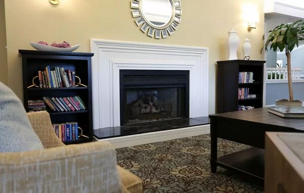 Built in fireplace surrounded by bookshelves in a Seasons and Courtyard at Seasons common area