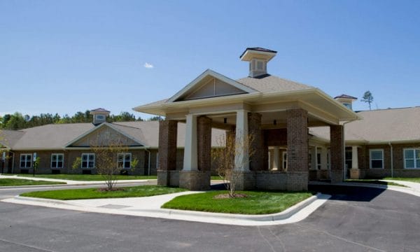 Covered front entrance and driveway at Chatham Ridge Assisted Living