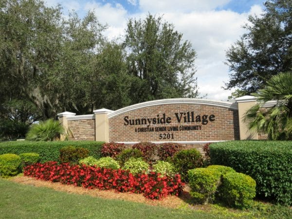 Sunnyside Village welcome sign and entrance to the community