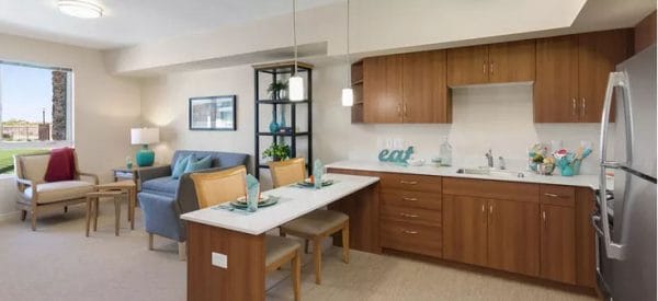 Apartment interior with eat in kitchen and spacious living room in Merrill Gardens at Anthem