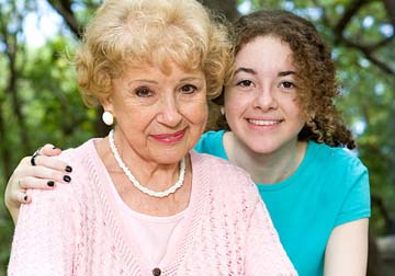 Sevens Home Care caregiver with her arm around senior woman