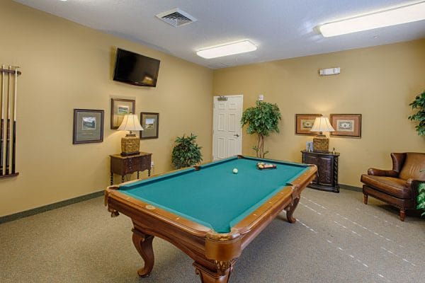 Green felt pool table in The Brennity at Tradition billiards room