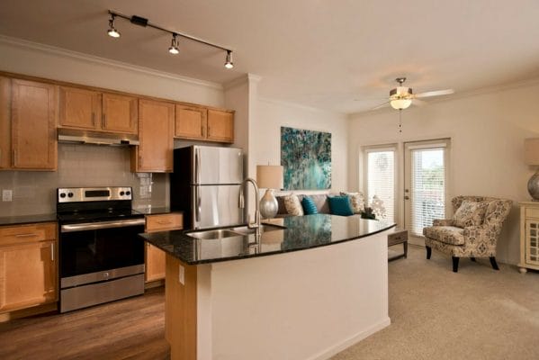 Model residence kitchen and living area in Diamond Oaks Village