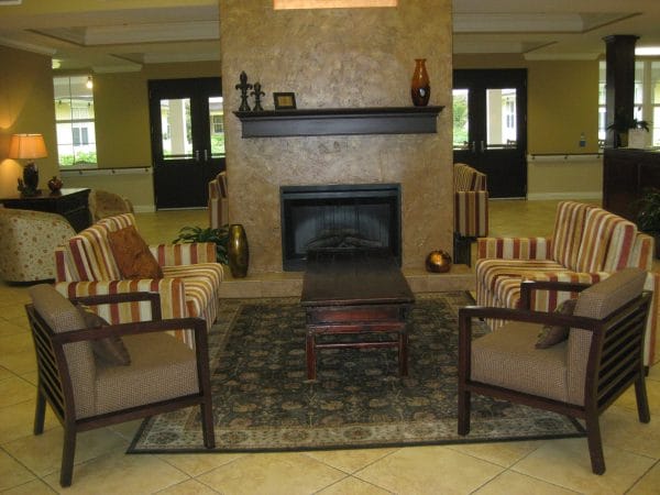The Beacon at Gulf Breeze resident living room with fireplace