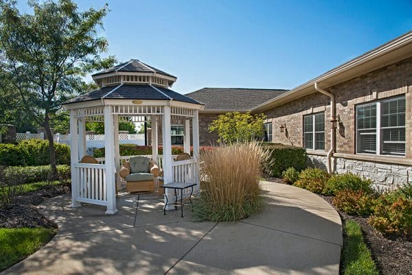 Outdoor gazebo and walking paths on the grounds of Charter Senior Living of Orland Park