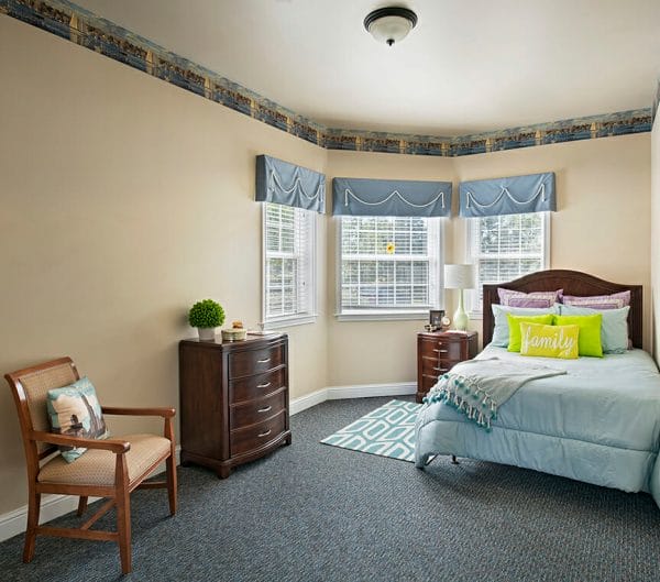 Model bedroom in a residence in Charter Senior Living of Orland Park