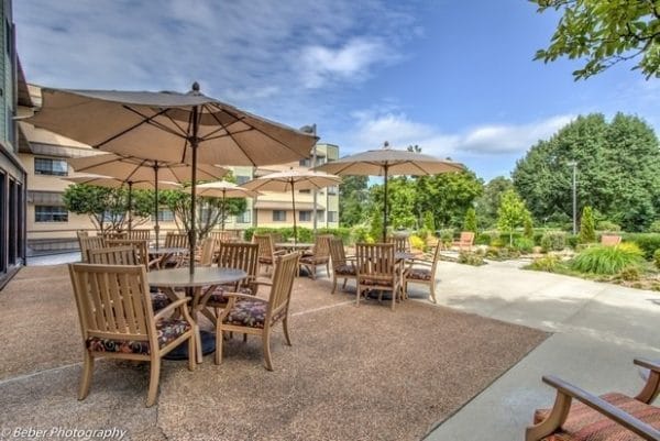 West Shores patio with umbrella tables