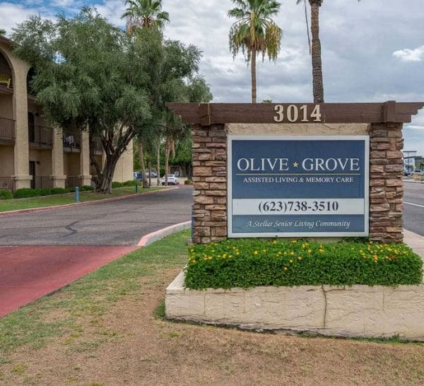Entrance sign in front of Olive Grove Retirement Community
