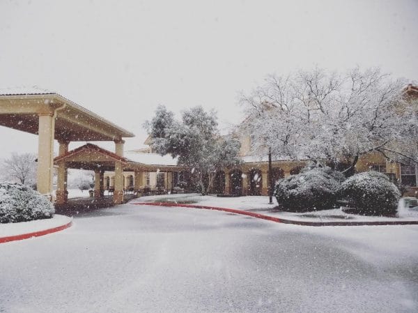 Prestige Assisted Living at Sierra Vista building exterior covered in snow