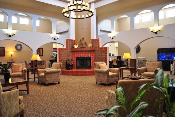 Lobby and living area with large fireplace for residents of Silver Springs