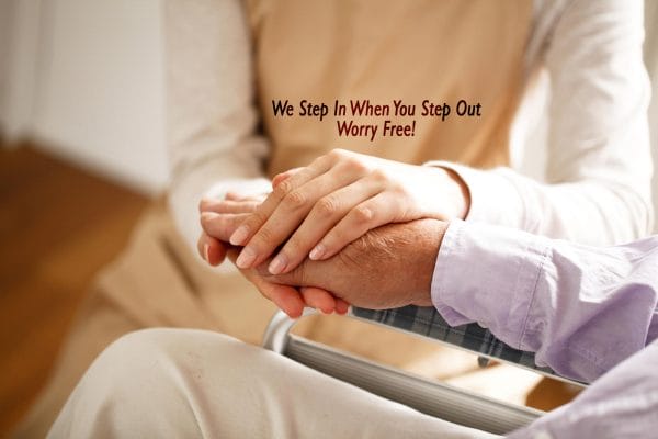 Caregivers That Deliver hands clasped with patient