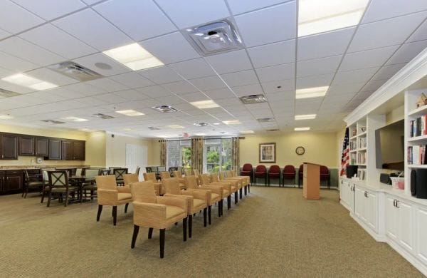 Community room with chairs lines up in Merrill Gardens at Barkley Place