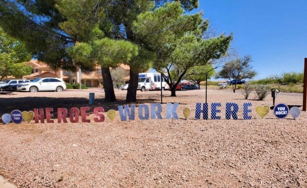 Heroes work here sign in front of Prestige Assisted Living at Sierra Vista