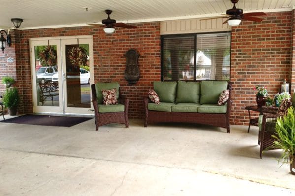 Front porch with resident seating at Magnolia Manor of Greenwood