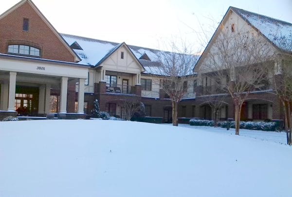 Oak Grove Inn building exterior in the winter covered in snow