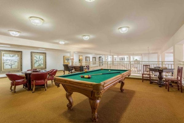 Billiards and card room with green felt pool table in Apple Blossom