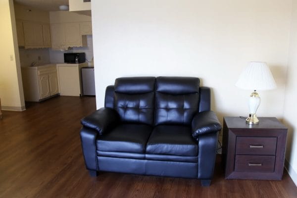 Leather loveseat in a model living room in an apartment at Catalina Village