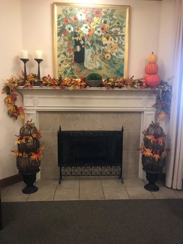 Fireplace decorated for fall in Oak Grove Inn
