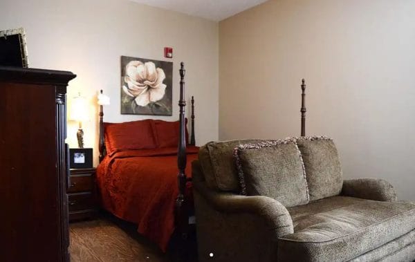 Morning Pointe of Tuscaloosa model bedroom with couch