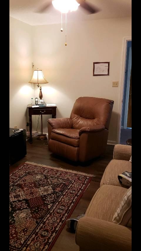 River Oaks West resident living room with overstuffed chair