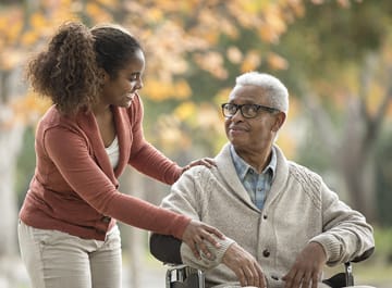Care Advantage - Hampton Roads caregiver helping senior man in wheelchair