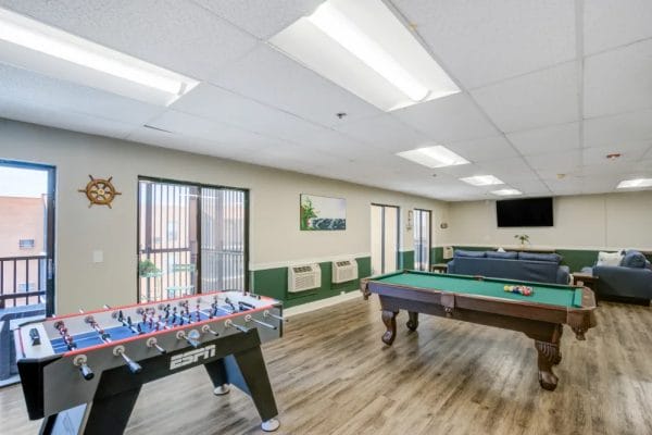 Foos ball and billiard table in the Truewood by Merrill Port Charlotte game room