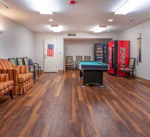 Game room with billiards table in Olive Grove Retirement Community