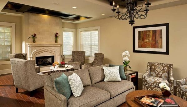 Community living room and fireplace in Sandalwood Village