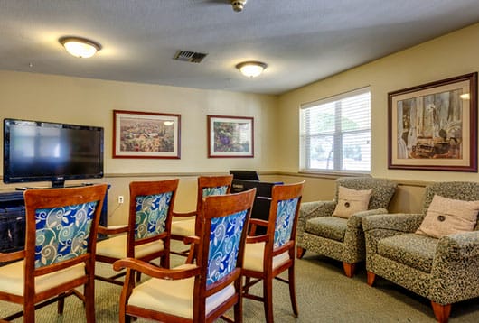 TV and living room lounge in Kingswood Place Assisted Living Community