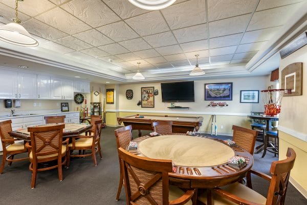 Game Room with Poker Table and Large Screen TV at Avista Senior Living Magnolia