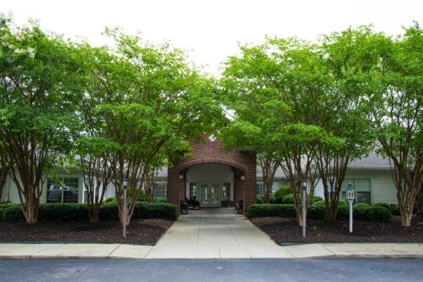 Entrance to Harbison Shores surrounded by green trees