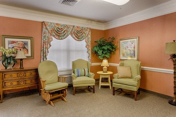 Common area with wing back chairs in The Brennity at Tradition