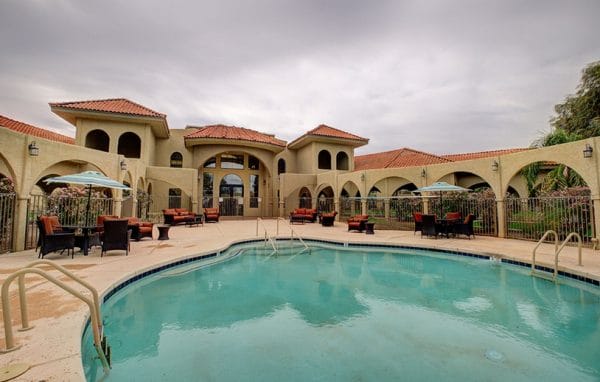 Outdoor swimming pool and lounging areas at The Garnet of Casa Grande