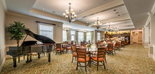 Benton House of Aiken dining room featuring large grand piano