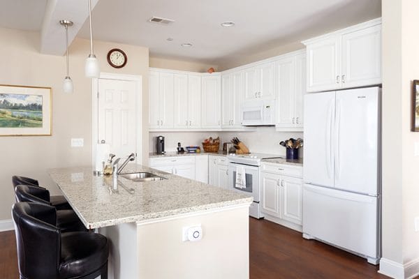 Abbotswood at Irving Park cottage model kitchen with white cabinetry