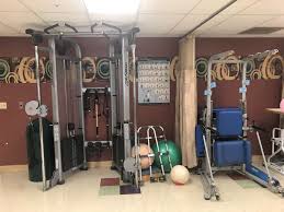 Exercise equipment and therapy area at Arden Courts of West Palm Beach