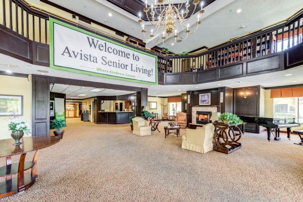Lobby with Fireplace and Reception Area at Avista Senior Living Magnolia