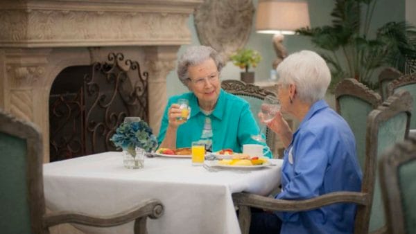 Two senior women enjoying a meal at Summer Vista