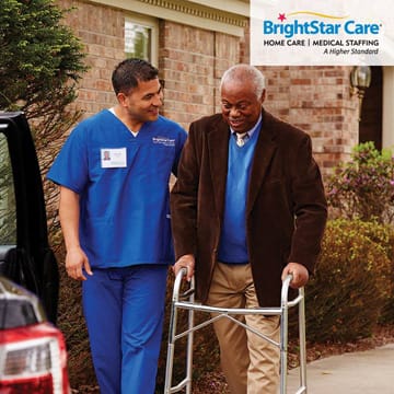 Senior man in walker being assisted by a BrightStar Care Of Columbia caregiver