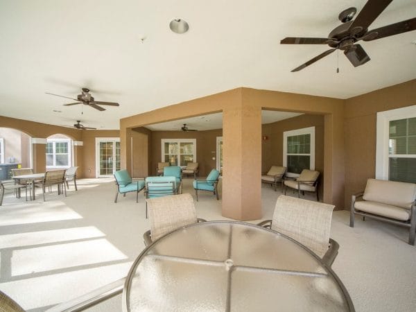 Outside patio with comfortable seating at Caroline Oaks Apartments