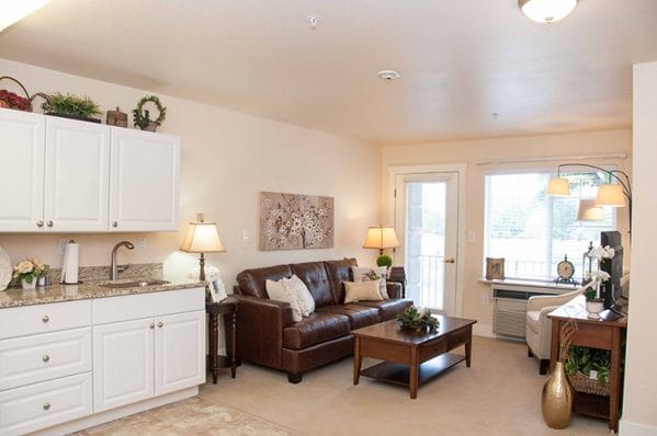 Model apartment living room and kitchenette in Cedarwood at Sandy
