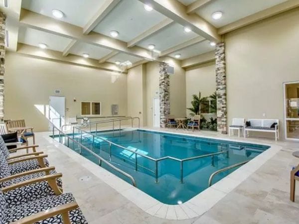 Indoor pool with vaulted coffered ceilings at Discovery Village At Sarasota Bay