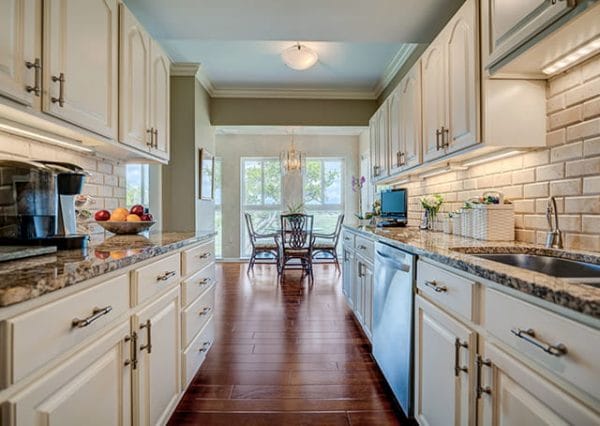 TidePointe model home kitchen with hardwood floors