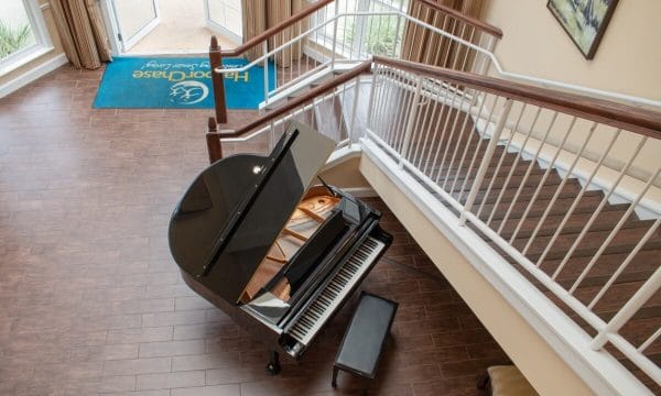 Aerial view of lobby and grand piano at HarborChase of Tallahasee