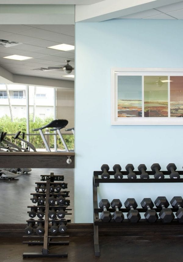 Fitness center at Harbour's Edge with dumbells and exercise equipment