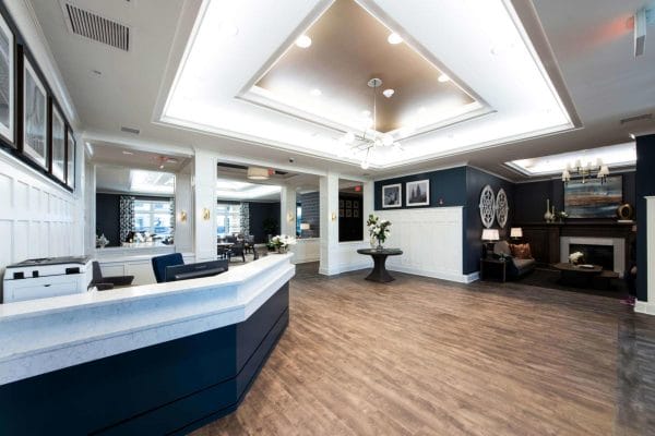 Pathway Heartis Village North Shore front desk and lobby ares with raised ceiling and hardwood floors