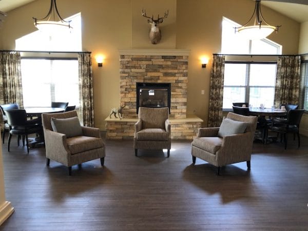Fireside seating in the Magnolia Place community living room