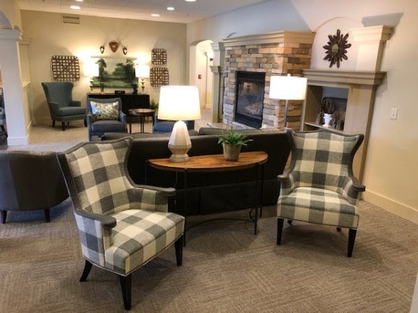 Plaid armchairs in the Magnolia Place common area