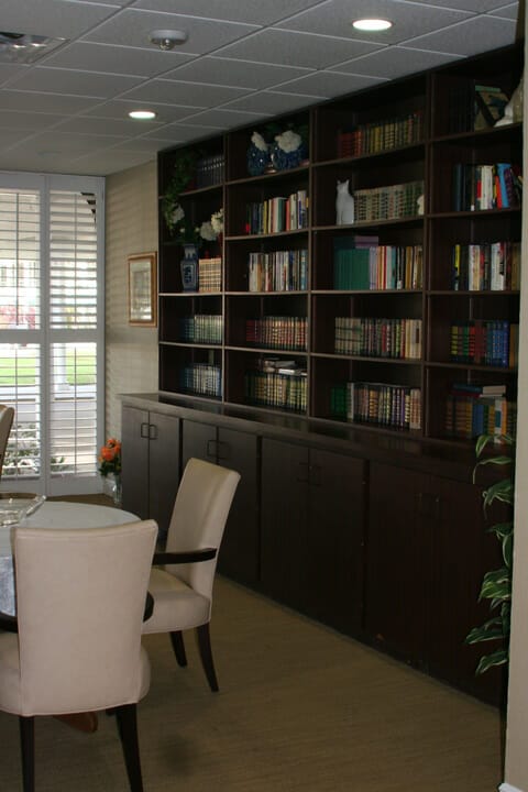 Community library with book lined walls in The Rose Garden of Orlando