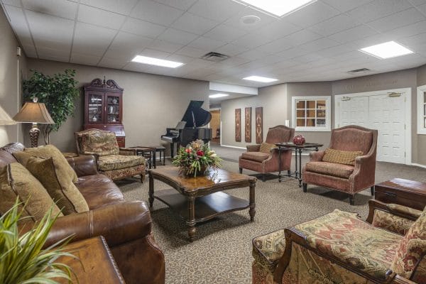 Common sitting area in the lobby of Aberdeen Heights Assisted Living with grand piano